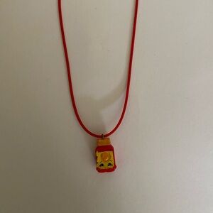 Shopkins on a red cord necklace